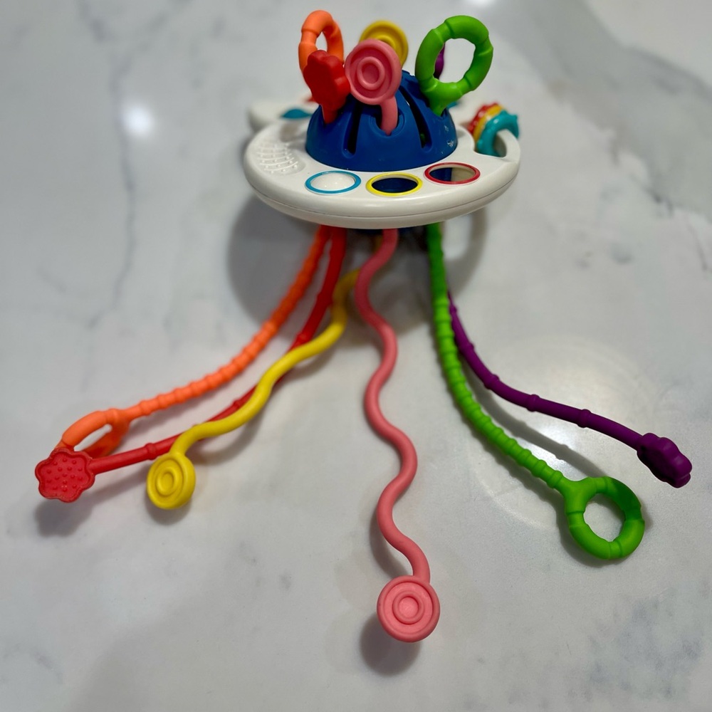 Pulling, popping fidget toy for toddlers and babies